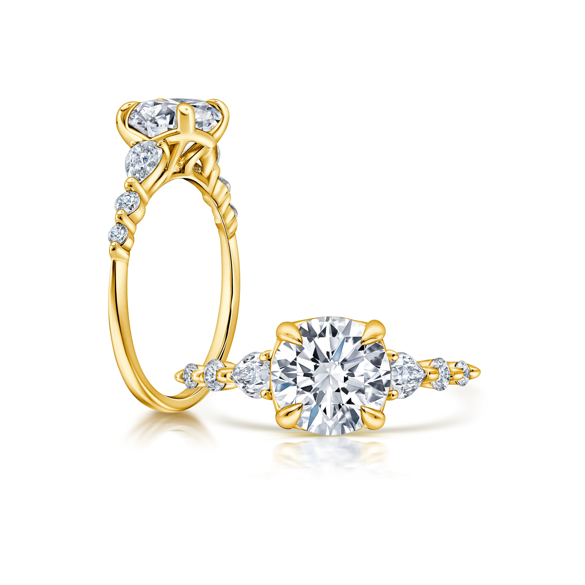 A classic twist on a three stone ring, this ring features two pear shape diamonds sitting on either side of your chosen center WSM675_4DIAW