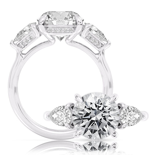 Peter Storm A classic three stone pear ring, adding a hidden halo for a little flair WSM734_4DiaW  WSM734_4DiaW