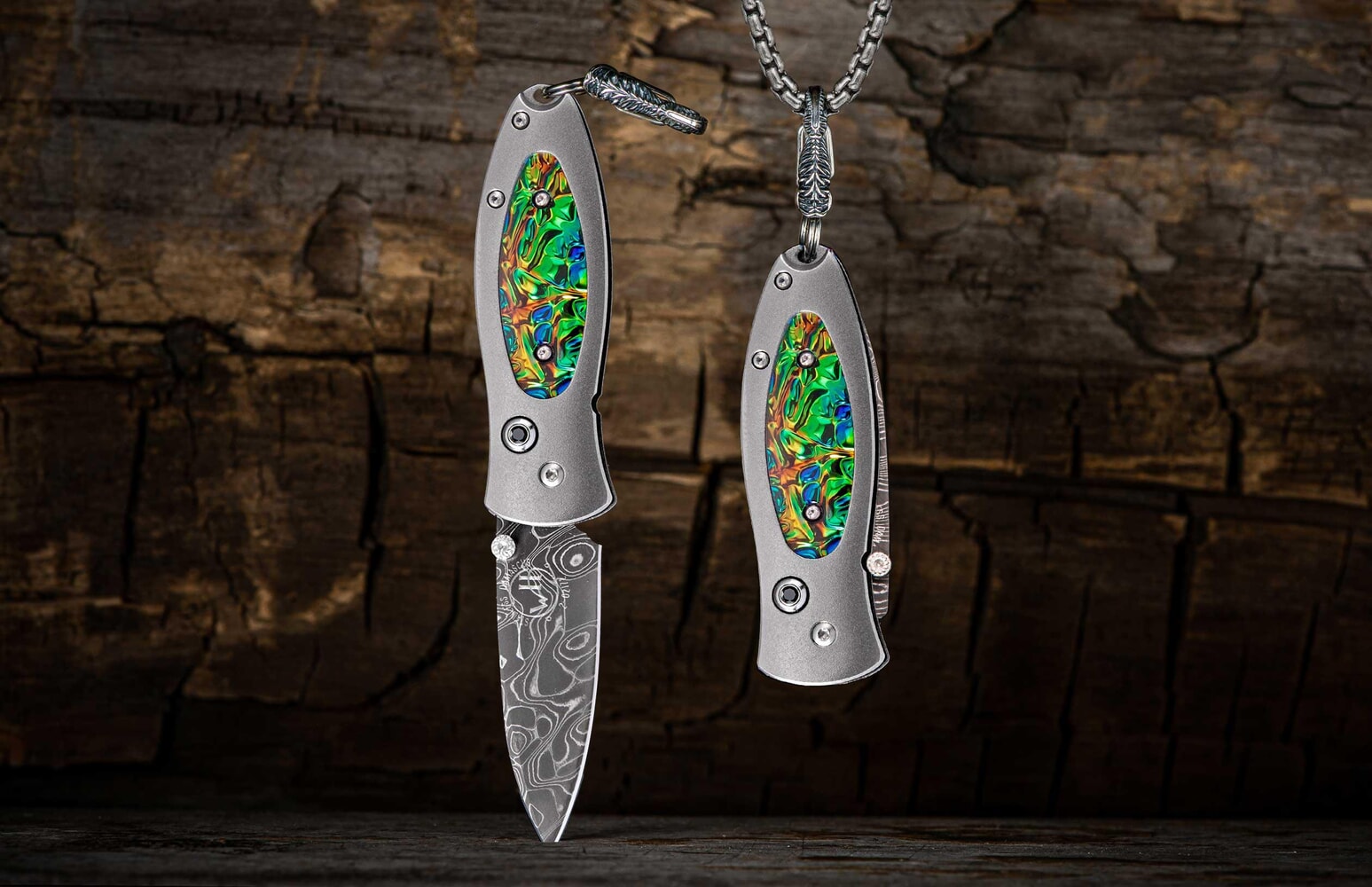 William Henry Titanium Knife pendant featuring Dichrolam®, and hand-forged damascus blade B02 FLASH