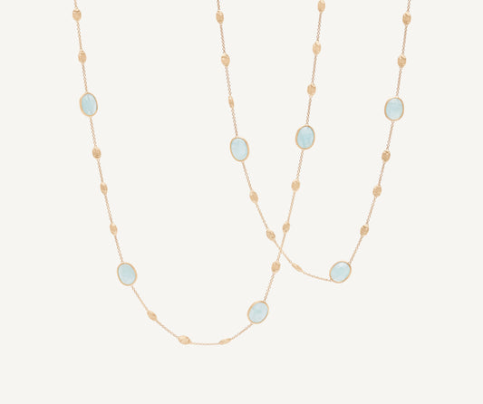 18kt yellow gold long necklace with small oval elements, aquamarines, and diamonds