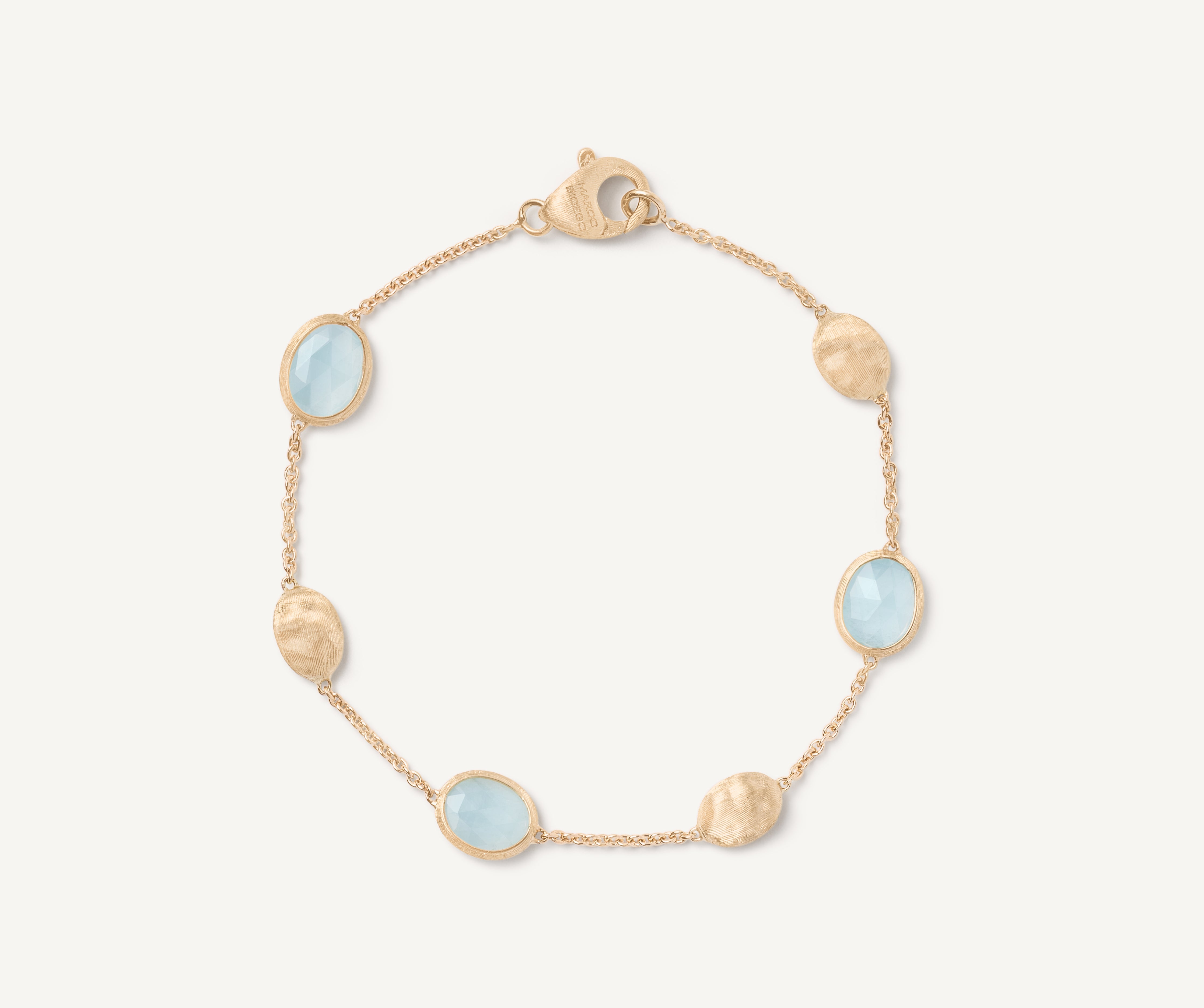 18kt yellow gold bracelet with oval elements and aquamarine